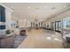 Spacious community room with comfortable seating and large windows at 8612 Sundance Loop, Sarasota, FL 34238