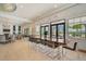 Bright community room with large table and pool view at 8612 Sundance Loop, Sarasota, FL 34238