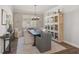 Elegant dining room featuring a rustic wood table and built-in hutch at 8612 Sundance Loop, Sarasota, FL 34238