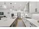 Modern kitchen with large island, stainless steel appliances, and white cabinets at 8612 Sundance Loop, Sarasota, FL 34238