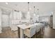 Open kitchen with island, stainless steel appliances, and breakfast bar at 8612 Sundance Loop, Sarasota, FL 34238