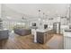 Open concept kitchen and living room with island and breakfast bar at 8612 Sundance Loop, Sarasota, FL 34238