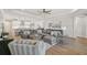Open-concept living room with a large sectional and kitchen views at 8612 Sundance Loop, Sarasota, FL 34238