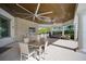 Community outdoor kitchen with seating and large TV at 8612 Sundance Loop, Sarasota, FL 34238