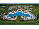 Resort-style pool with spacious deck and surrounding landscaping at 8612 Sundance Loop, Sarasota, FL 34238