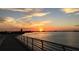 Peaceful sunset over the water, seen from a bridge at 8612 Sundance Loop, Sarasota, FL 34238