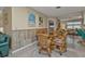 Dining room with a glass-top table and wicker chairs at 881 Callan St, Englewood, FL 34223