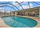 Large screened pool with access to patio at 881 Callan St, Englewood, FL 34223