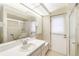 Bathroom boasts a walk-in shower and updated vanity at 917 S Doral Ln, Venice, FL 34293