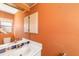 Bathroom with vanity and tiled backsplash at 917 S Doral Ln, Venice, FL 34293