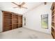 Bedroom with built-in wooden shelving at 917 S Doral Ln, Venice, FL 34293