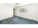 Bright bedroom with blue carpet and ample closet space at 917 S Doral Ln, Venice, FL 34293