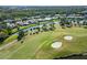 Aerial view of golf course and surrounding homes at 917 S Doral Ln, Venice, FL 34293