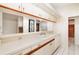 Kitchen with white cabinets and double sink at 917 S Doral Ln, Venice, FL 34293