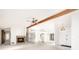 Open living room with high ceilings, a fireplace, and access to other rooms at 917 S Doral Ln, Venice, FL 34293