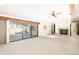 Spacious living room with fireplace and sliding glass doors leading to a patio at 917 S Doral Ln, Venice, FL 34293