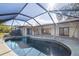 Relaxing kidney-shaped pool with screened enclosure at 917 S Doral Ln, Venice, FL 34293