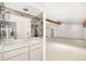 Home bar with mirrored backsplash and sink at 917 S Doral Ln, Venice, FL 34293