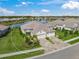 Aerial view of single Gathering home with lake view at 10024 Lake Wales Cir, Sarasota, FL 34241