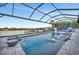 Luxury pool with screened enclosure and water features at 1027 Kestrel Ct, Bradenton, FL 34208