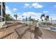 Spacious deck overlooking the water with outdoor furniture at 11 Sunset Dr # 406, Sarasota, FL 34236