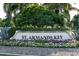 St. Armands Key entrance sign with lush landscaping at 11 Sunset Dr # 406, Sarasota, FL 34236
