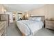 Spacious main bedroom with ensuite bathroom and ample dresser space at 11 Sunset Dr # 406, Sarasota, FL 34236