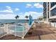 Spacious pool deck with ocean views and lounge chairs at 11 Sunset Dr # 406, Sarasota, FL 34236