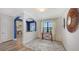 Elegant foyer with blue accent wall and archway at 12607 Wheatgrass Ct, Parrish, FL 34219