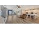 Open living room with kitchen island and hardwood floors at 12607 Wheatgrass Ct, Parrish, FL 34219