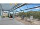 Screened patio boasts a hot tub and comfortable seating at 12607 Wheatgrass Ct, Parrish, FL 34219