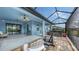 Covered patio with hot tub, seating, and string lights at 12607 Wheatgrass Ct, Parrish, FL 34219