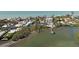 An aerial view shows waterfront homes, boat docks, and direct access to the open water at 140 N Casey Key Rd, Osprey, FL 34229