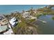 Aerial view of a luxury waterfront home and its private dock at 140 N Casey Key Rd, Osprey, FL 34229
