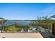 Deck showcasing outdoor seating and lovely water views at 140 N Casey Key Rd, Osprey, FL 34229