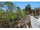 Pathway leading to an outdoor entertainment area and kitchen at 140 N Casey Key Rd, Osprey, FL 34229