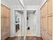 Hallway with closet and access to the bathroom and toilet rooms at 140 N Casey Key Rd, Osprey, FL 34229