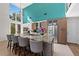 Bright kitchen featuring a large island with seating, stainless steel appliances, and modern cabinetry at 140 N Casey Key Rd, Osprey, FL 34229