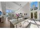 Well-lit kitchen with high ceilings and an open floor plan for modern living at 140 N Casey Key Rd, Osprey, FL 34229