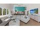Open floor plan featuring living room connected to the kitchen and high ceilings at 140 N Casey Key Rd, Osprey, FL 34229