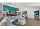 Beautiful living room with high ceilings, an accent wall, and an open layout at 140 N Casey Key Rd, Osprey, FL 34229