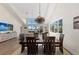 Open concept living space showcasing the dining room with vaulted ceilings, bright light and an open concept at 140 N Casey Key Rd, Osprey, FL 34229