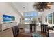 Inviting space that captures an open dining and living room with windows allowing for light filled space at 140 N Casey Key Rd, Osprey, FL 34229