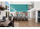 Open floor plan shows bright kitchen, open living space with dining room, natural light, and vaulted ceilings at 140 N Casey Key Rd, Osprey, FL 34229