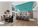 Bright living space showcases an open floor plan between kitchen, dining room, and living area at 140 N Casey Key Rd, Osprey, FL 34229