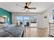 Spacious bedroom with waterfront views and balcony access to the beautiful pool area at 140 N Casey Key Rd, Osprey, FL 34229