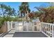 Outdoor stainless steel grill and outdoor kitchen with a beautiful deck at 140 N Casey Key Rd, Osprey, FL 34229