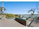 Outdoor pool and deck overlooking tranquil water views with outdoor seating at 140 N Casey Key Rd, Osprey, FL 34229