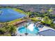 Heart-shaped pool with surrounding lounge chairs at 14608 Derna Ter, Bradenton, FL 34211