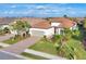 Aerial view of house, showing driveway, landscaping, and neighborhood at 14608 Derna Ter, Bradenton, FL 34211